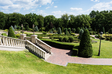white stairs near walkway and green trees in park