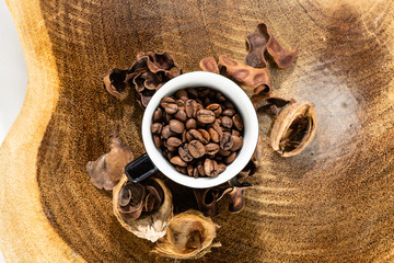 cup with coffee beans and rustic background