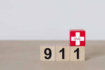 Wooden blocks with Emergency Number 911 Services.