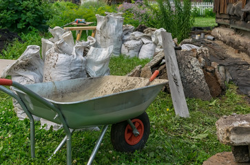 construction waste, transport trolley and other tools are located on the territory of a private...