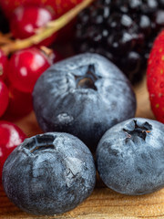 Close-up view of mixed, assorted berries blackberry, strawberry, background. Colorful and healthy concept.