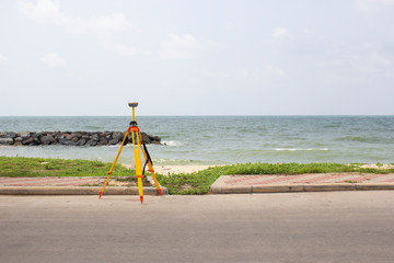 GPS surveying in field sea background, Global Positioning System.