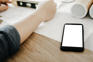 Mockup image of engineers pointing drawing design building Project in office, mockup concept