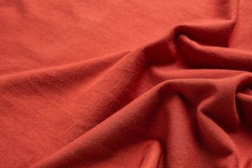 Fototapeta premium Orange-red cotton knit fabric texture material