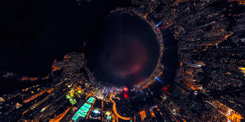 Panorama aerial view of Hong Kong City at night with fireworks