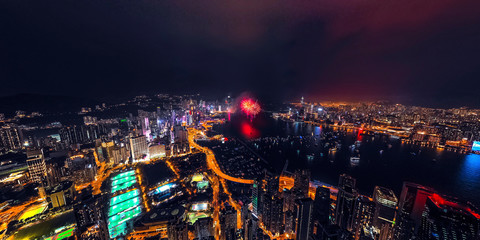 Fototapeta na wymiar Panorama aerial view of Hong Kong City at night with fireworks
