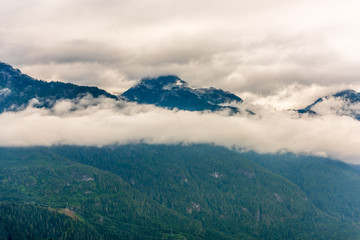 Aerial View at Mountains on Foggy and Misty Fall Morning in British Columbia, Canada. 