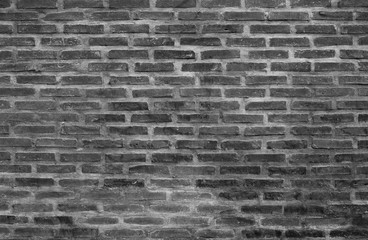 Black wall background The surface of the brick dark jagged.