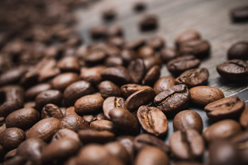 Close up coffee beans on brown wooden background