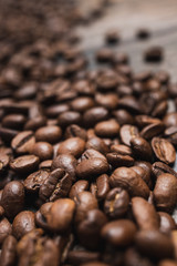 Close up coffee beans on brown wooden background
