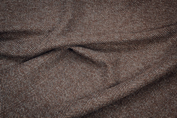 Fabric coat gray tweed. Color texture of the coat fabric close-up.