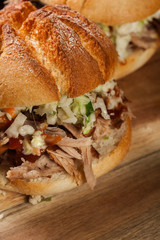 Homemade pulled pork burger with coleslaw salad