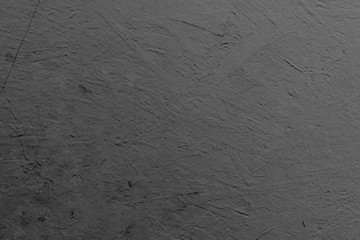 Texture of a concrete wall with cracks and scratches which can be used as a background