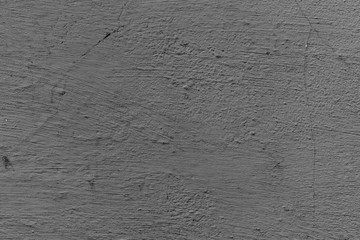 Texture of a concrete wall with cracks and scratches which can be used as a background