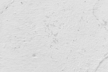 Texture of a concrete wall with cracks and scratches which can be used as a background