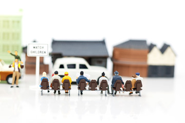 Miniature people: Tourists and shoppers wait bus in the city.