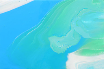 photography of abstract marbleized effect background. Blue, mint and white creative colors. Beautiful paint.