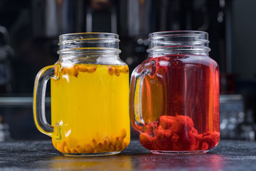 Lemonade or Mojito cocktail with lemon and mint, raspberry, sea buckthorn, grapefruit, cold refreshing drink or drink with ice