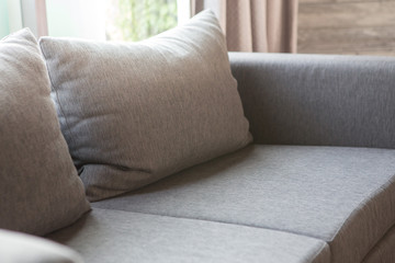 Pillow on the sofa in living room With light and shadow