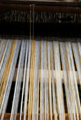 Traditional loom in Antigua Guatemala, means of economic income, family tradition and ancestral culture typical designs of textiles.