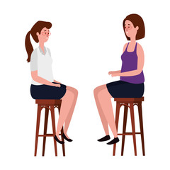 elegant businesswomen seated in benchs