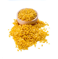 peeled split mung bean in wooden spoon isolated on white background