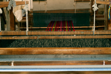 Traditional loom in Antigua Guatemala, means of economic income, family tradition and ancestral culture typical designs of textiles.