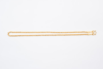 Gold chain necklace isolated on white background.