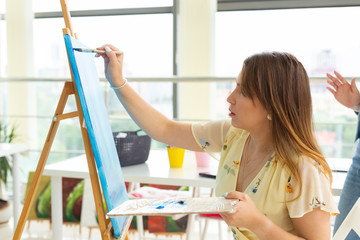 painting art classes. drawing courses. skills imagination and inspiration. Charming student girl...