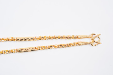 Gold chain necklace isolated on white background.