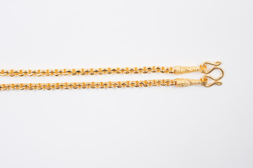 Gold chain necklace isolated on white background.