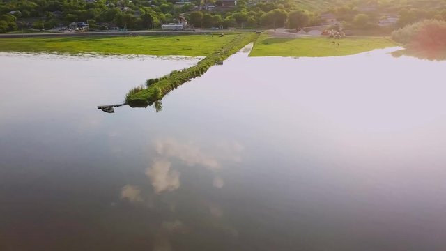 Flying over the river on a sunny summer day. Dniester river of Moldova republic.