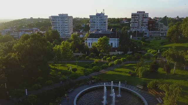 Aerial view of Slatina city and river Olt, Romania. Drone flight over the european city in summer day.