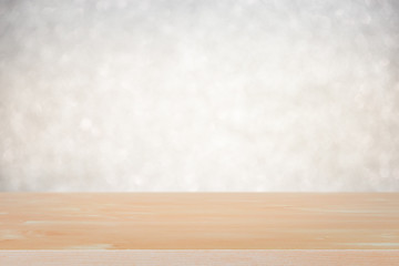 Empty wood table top on white bokeh abstract background.