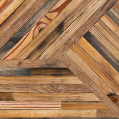 Light parquet floor with geometric pattern. Partially charred wooden texture for background. Texture of  wooden planks.