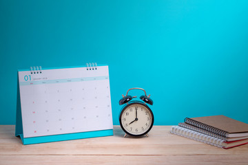Vintage clock and calendar on wood, time concept