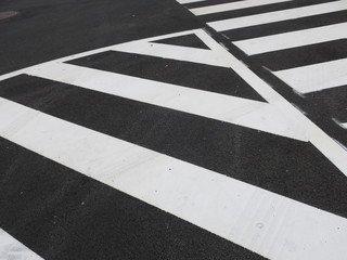 white traffic stripes painted on an asphalt road