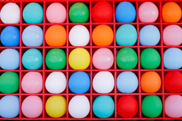 A background of balloons inside boxes