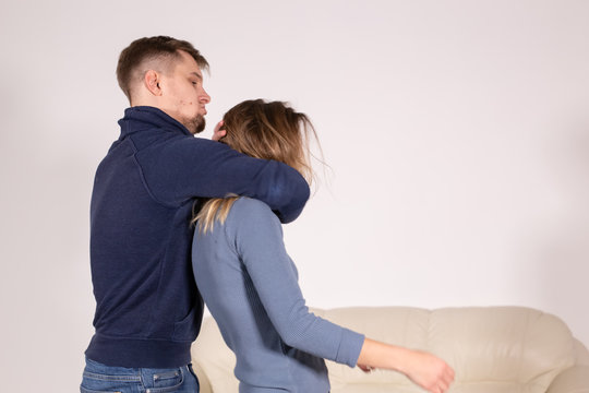 people, abuse and violence concept - agressive man strangling his wife