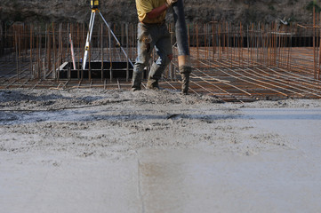 Concrete pouring during commercial concreting floors of buildings in construction