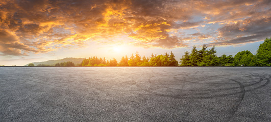 Wide race track and green woods nature landscape at sunset © ABCDstock