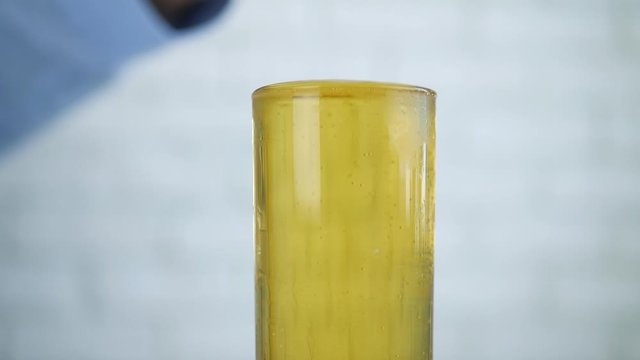 Shooting with a Empty Bottle and a Glass Full Filled with Cold and Fresh Beer