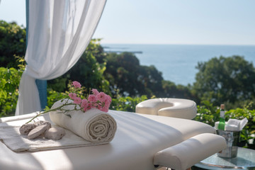 Naklejka na ściany i meble Massage table with sea view