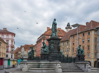 Fototapeta na wymiar Erzherzog Johann fountain at Hauptplatz (main square), in Graz, Styria region, Austria.