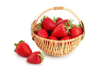 strawberries in a wicker basket isolated on white background