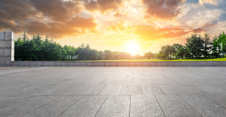 Empty square floor and green woods natural scenery in city park