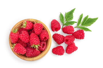 raspberries in wooden bowl with leaves isolated on white background. Top view. Flat lay