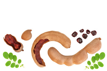 Tamarind fruit with leaf and seed isolated on white background with copy space for your text. Top view. Flat lay