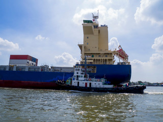 Container Cargo ship with tugboat