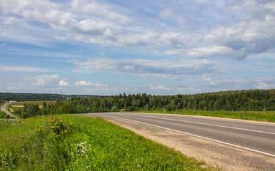 Fototapeta na wymiar The road going along steep hills, Moscow region